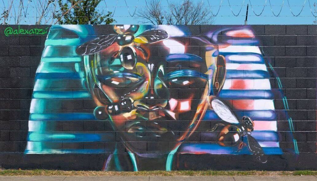 Mural resembling an Egyptian mummy along the outer wall of the Kashmere bus operating facility at 5700 Eastex Freeway in Houston