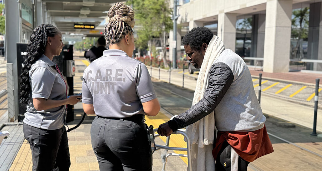 METRO CARES unit assist a man at the Downtown Transit Center METRORail platform.